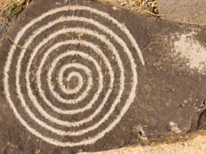 Spiral circle of life petroglyph. Ancient Pueblo etching located at Petroglyph National Monument, Albuquerque, New Mexico.